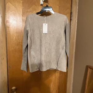 New with tags top. it is a medium large. The color is camel.